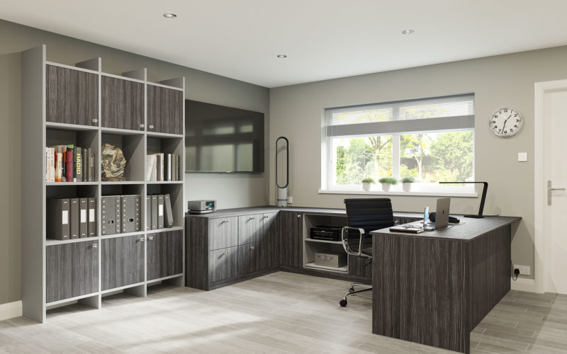 Modern office suite which has a large wrap around desk with cupboards and a freestanding cupboard which consists of part display and part hidden storage.