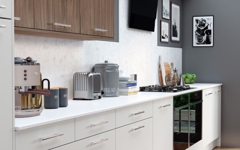 Small kitchen with white lower cupboards and wooden upper cabinets. Integrated with two ovens and a hob. Marble look backsplash along the length of the kitchen.