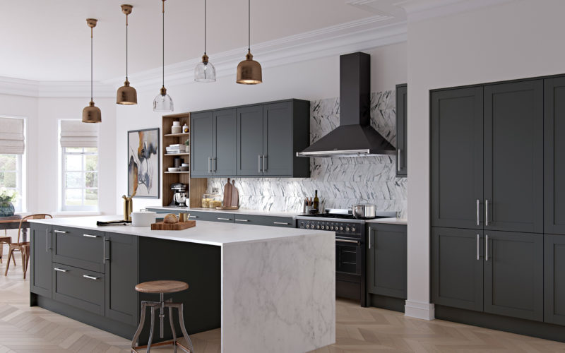 Modern kitchen with graphite coloured cabinets and island. Countertops are white marble with the marble running down the side of the island to create a table to sit at