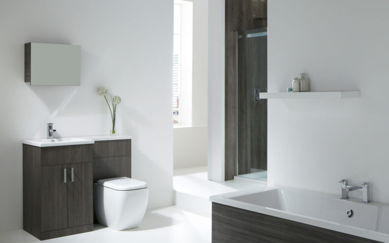 Modern white walled bathroom with dark grey wood features in the cabinets, shower and bathtub