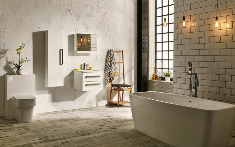 Rustic bathroom suite wit modern white freestanding bath and white toilet unit and floating cabinet