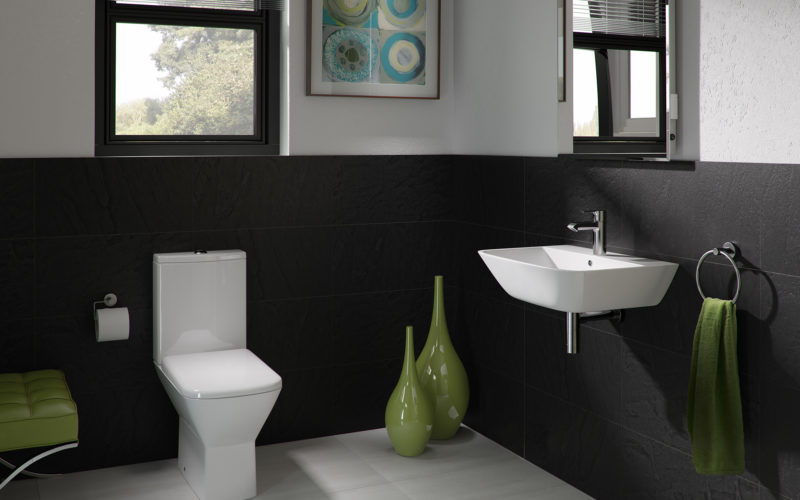 Modern black tiled toilet suite with white sink and toilet