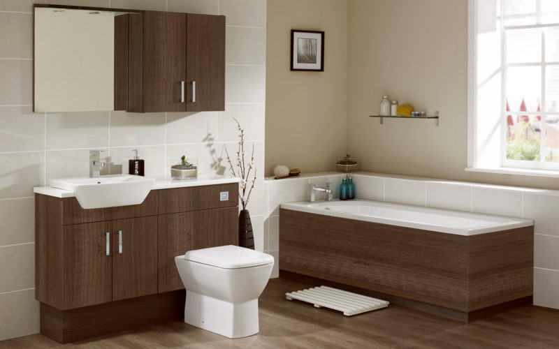 Sink and toilet unit in walnut with an enclosed bath in walnut